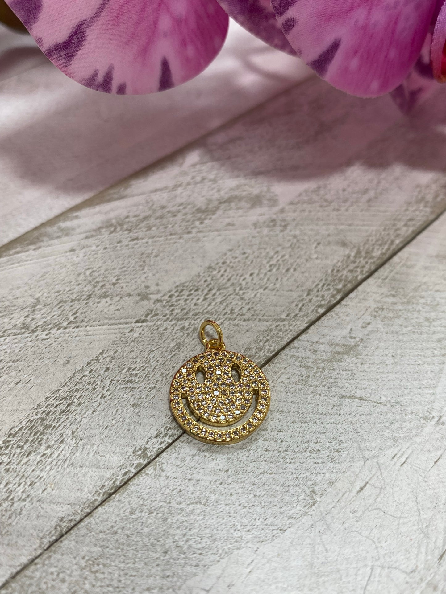 Charms happy face zirconia