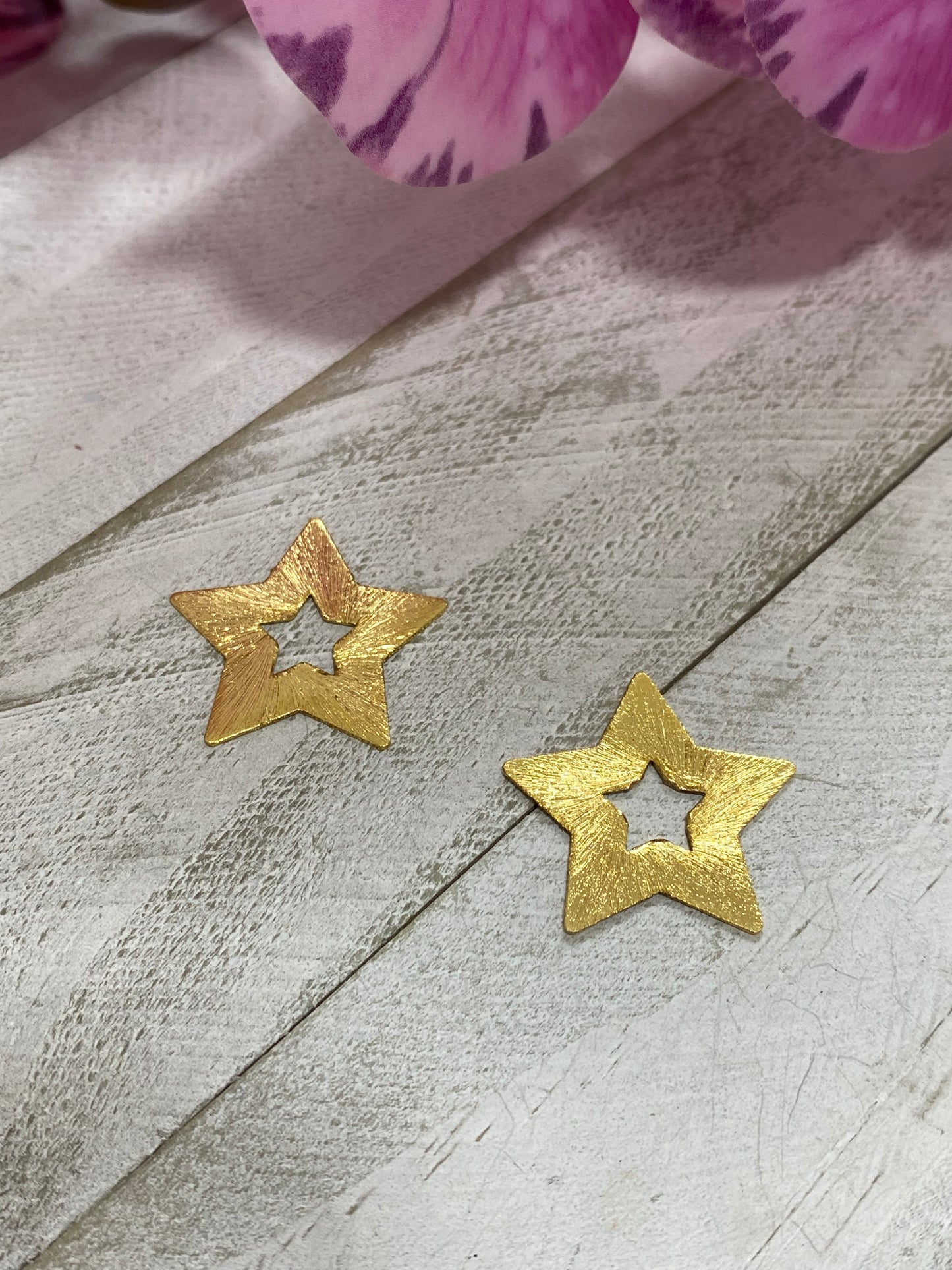 Charms estrella dorada