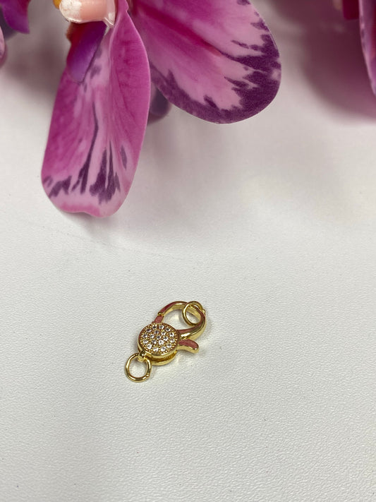 Cierre con zirconias dorado